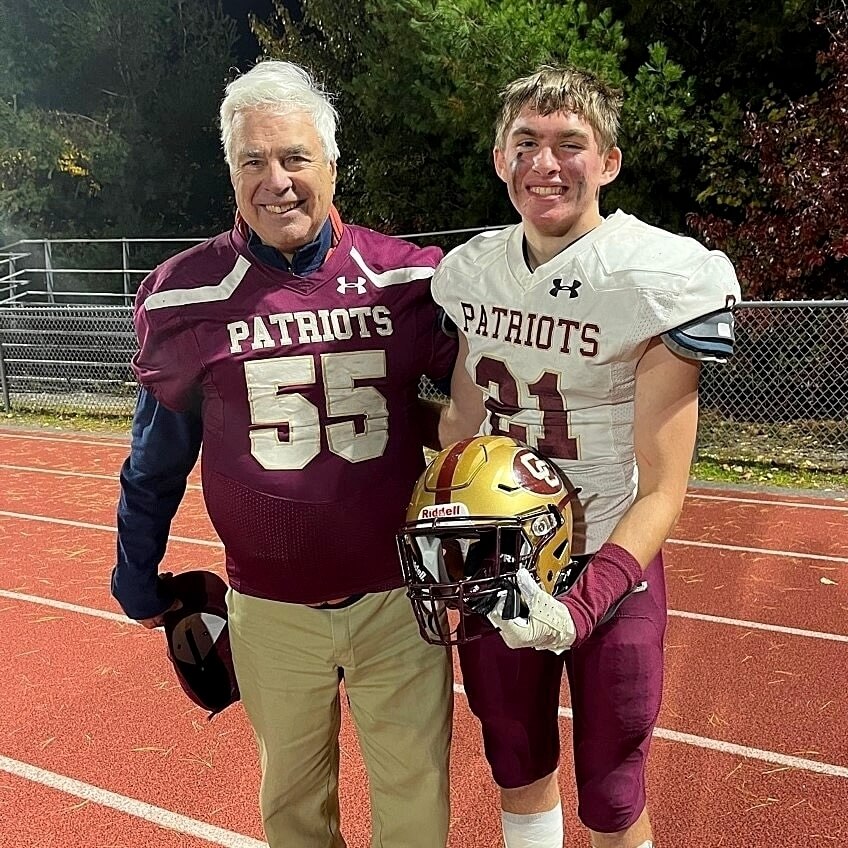 Joe Martines Concord High School class of 1955 (left) with grandson Concord-Carlisle senior Ryan Martines after C-C’s win over Acton-Boxborough