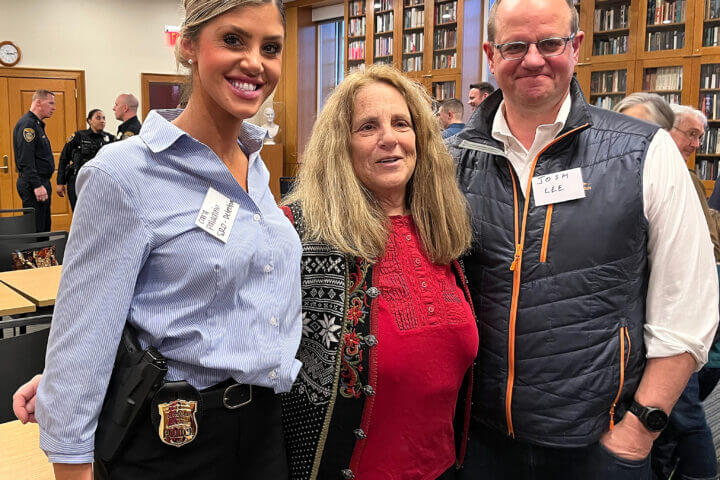 Officer Cara Paladino, l., with Select Board member Terri Ackerman and DEI co-chairman Josh Lee.