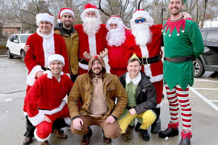 Top Left: John Palusci, Marco Beltran, Mike Julian, Dan Healy, Charles O'Malley, and the Elf is Brian Burkhard. Bottom Left: Ross Collins, James Hogan (reindeer) and Patrick Cooper.